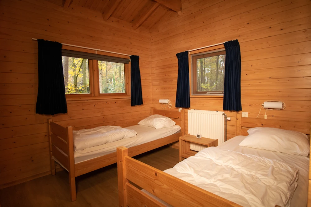 Slaapkamer in Het Houten huis – comfortabele inrichting voor 4 personen, ideaal voor een verblijf in de Achterhoek.
