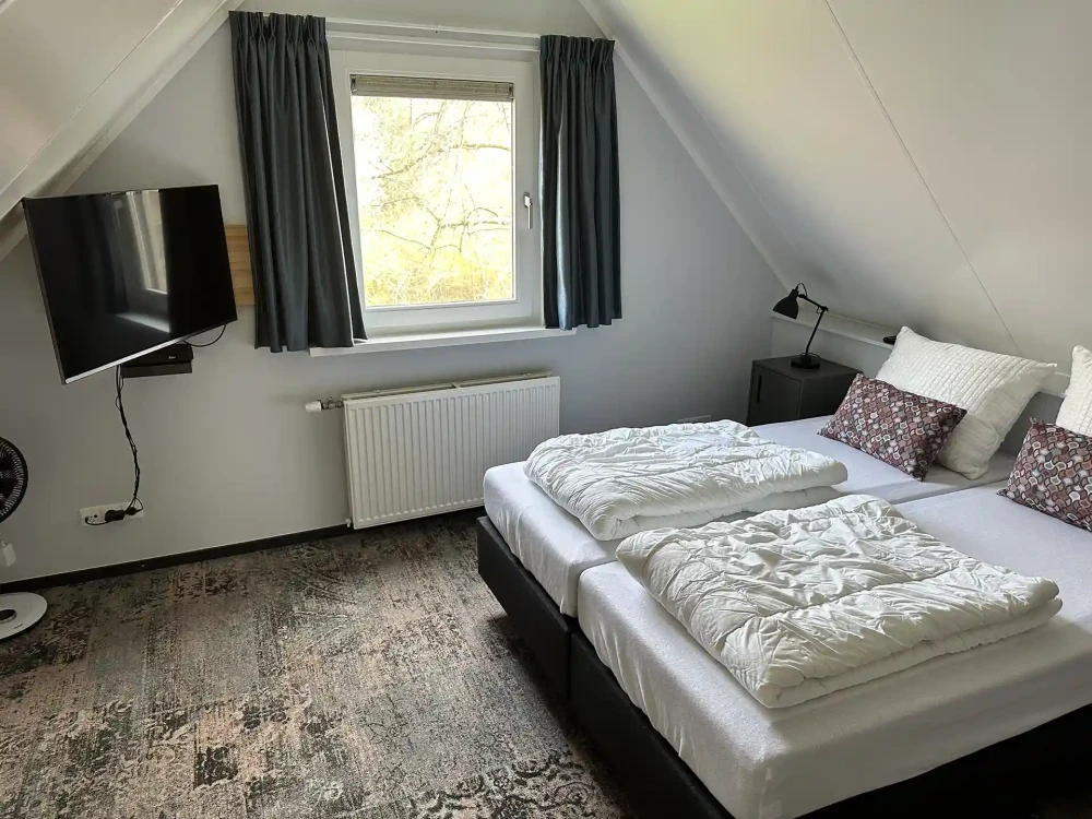 Slaapkamer in Borboleta – comfortabele inrichting voor 5 personen, ideaal voor een verblijf in de Achterhoek.